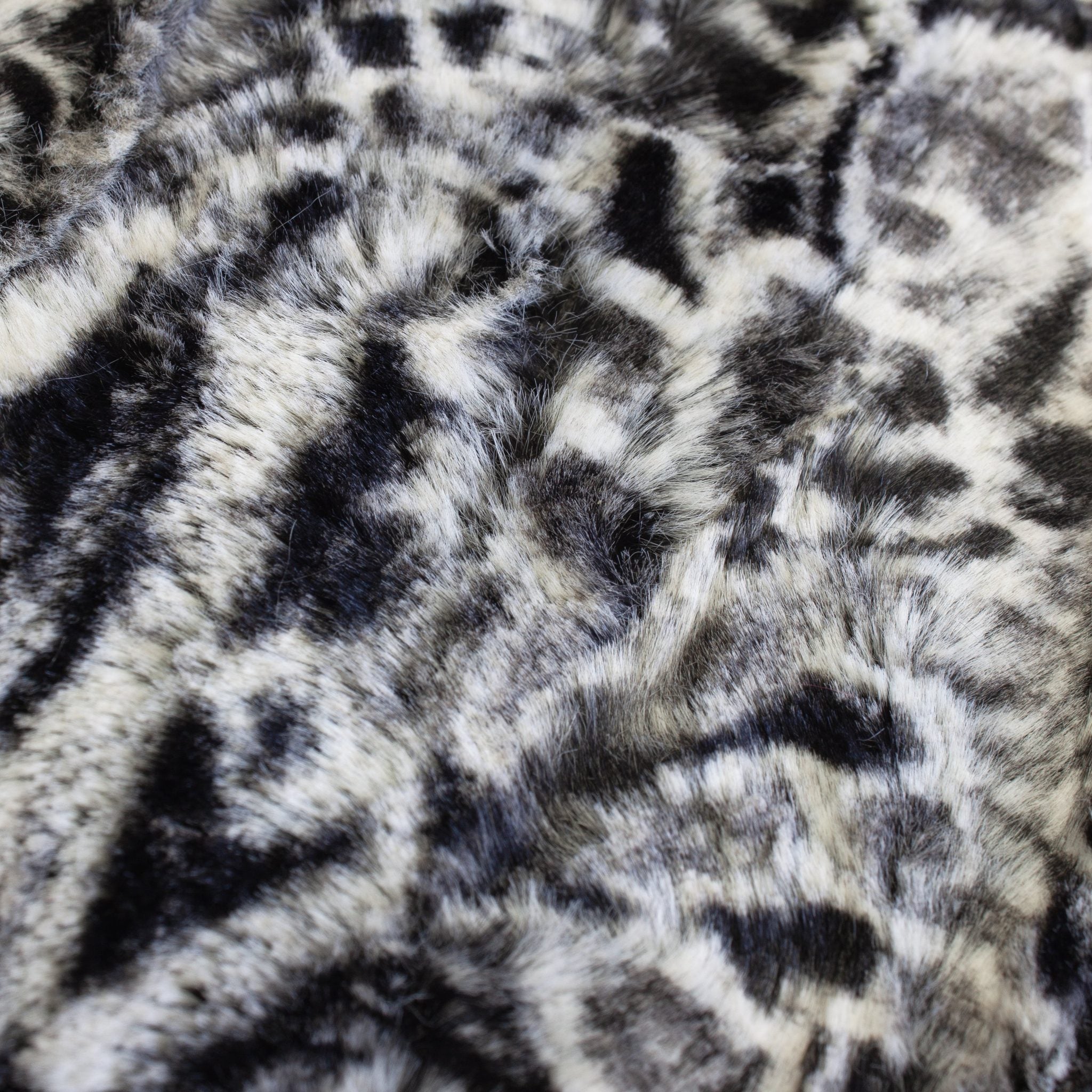 black spotted leopard snuggle minky fabric, folded drape