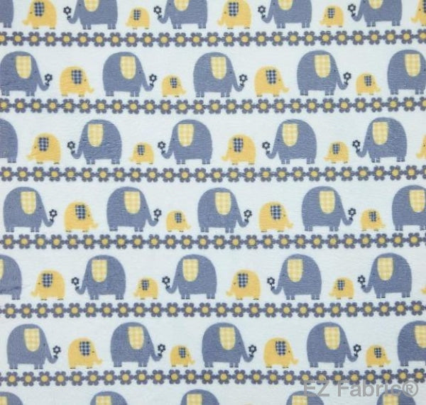 Marching elephants yellow print minky fabric, close-up